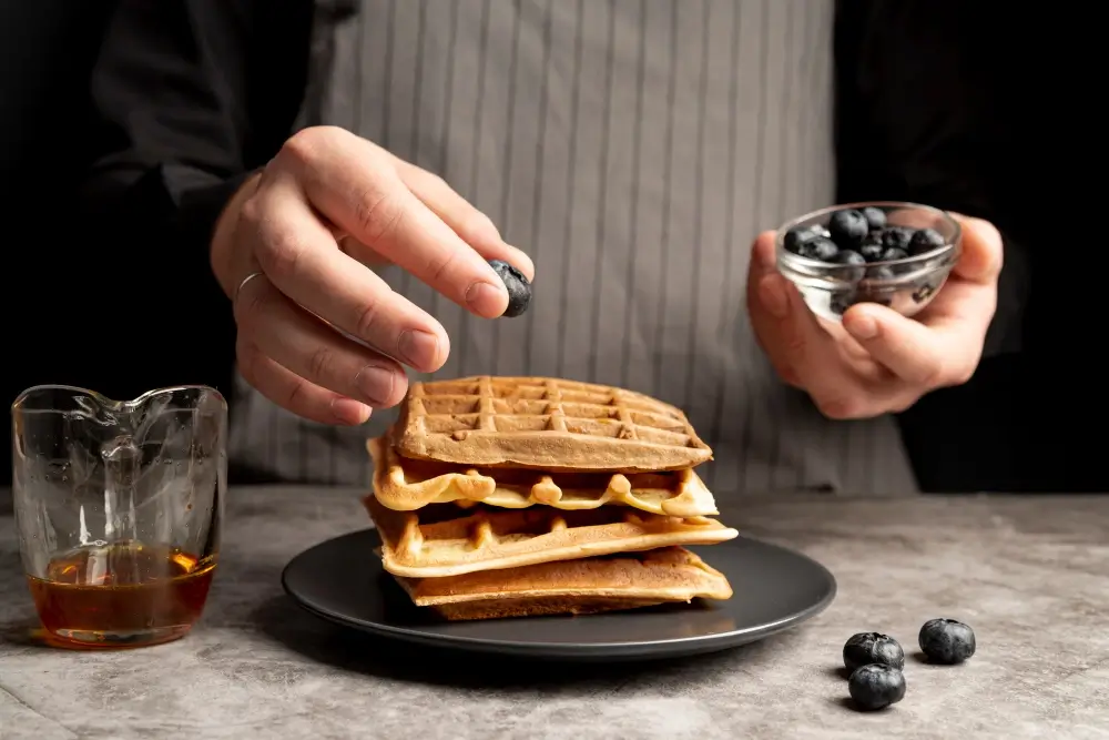 adding toppings on waffles